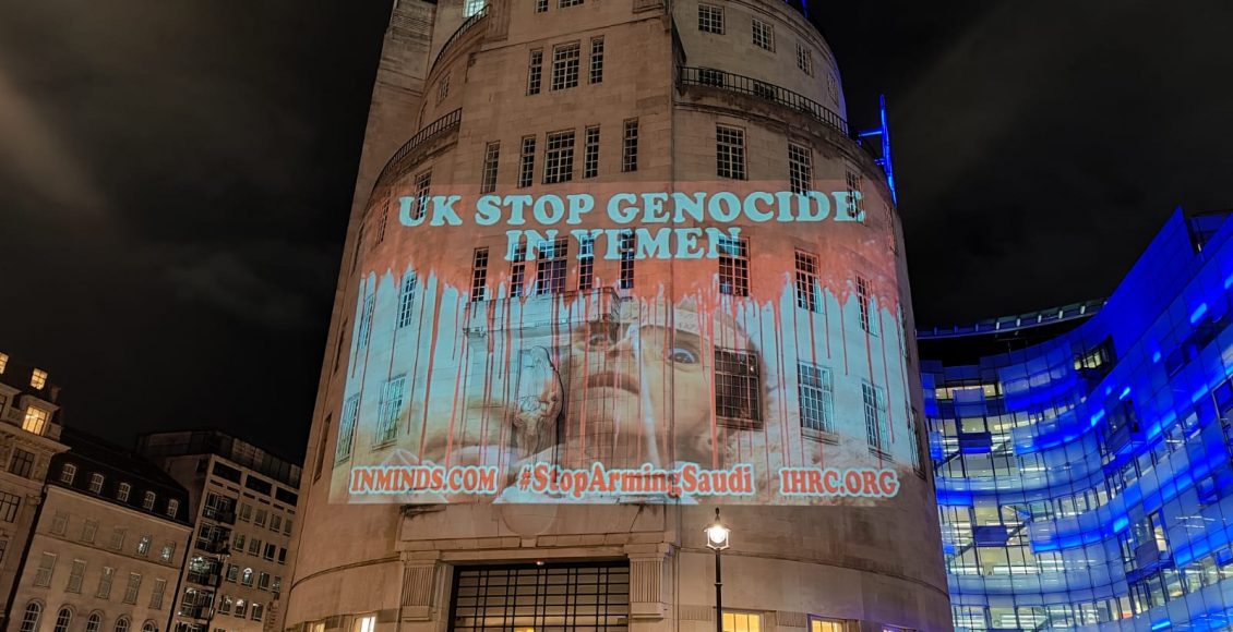 Activists display pictures of Yemen war victims on BBC building in London